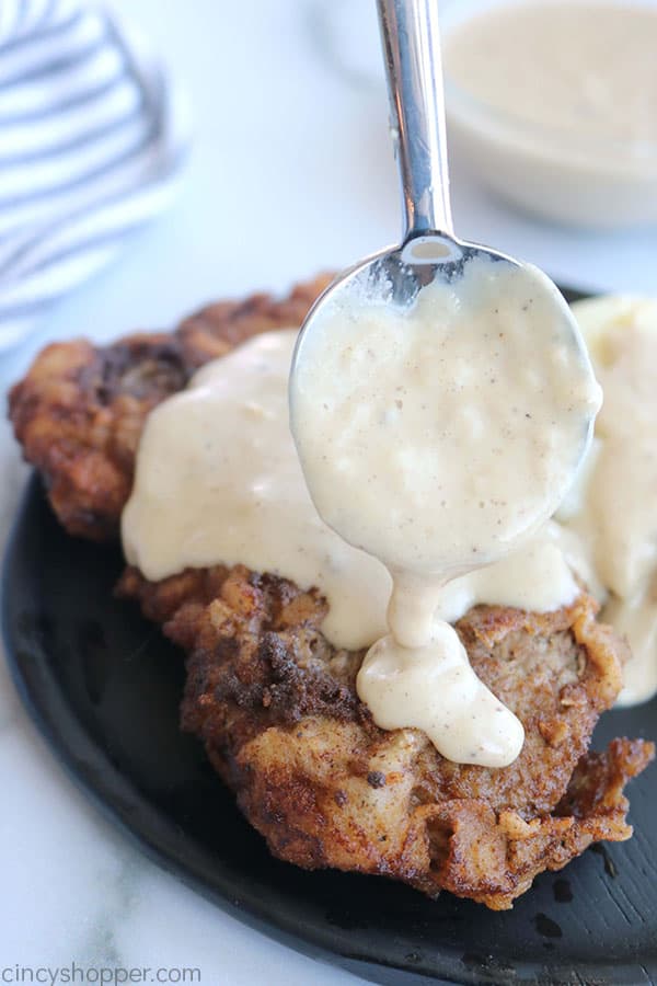 White Gravy on spoon for Chicken Fried Steak