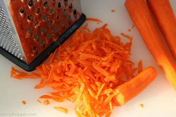 Grating carrots for homemade coleslaw