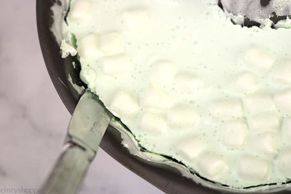 Cutting the edges of Jello Salad in mold.