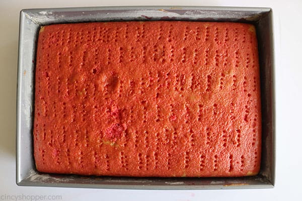 Chilled poke cake in a pan.