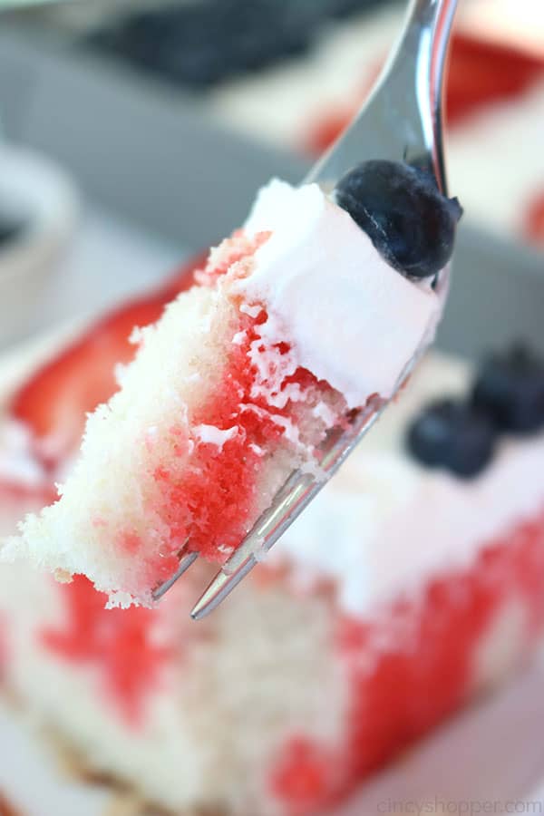 Fork with red, white, and blue cake.