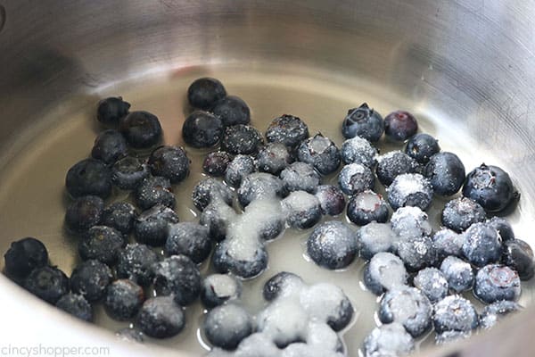 Blueberries in a pan to make easy blueberry sauce