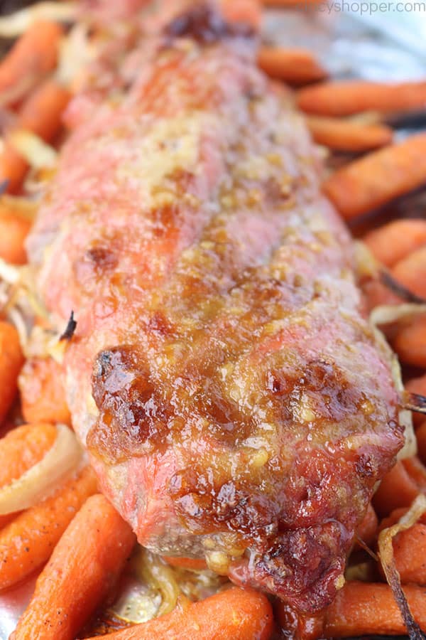 Cooked Pork Tenderloin with carrots and onions.