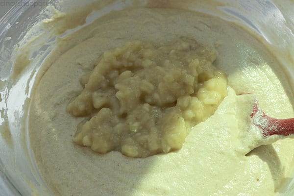 Folding in the bananas to cake batter.