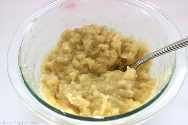 Mashed overripe bananas in a bowl.