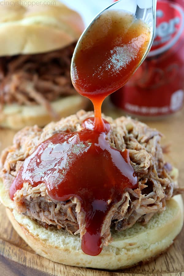 Dr. Pepper barbecue sauce added to pulled pork sandwich