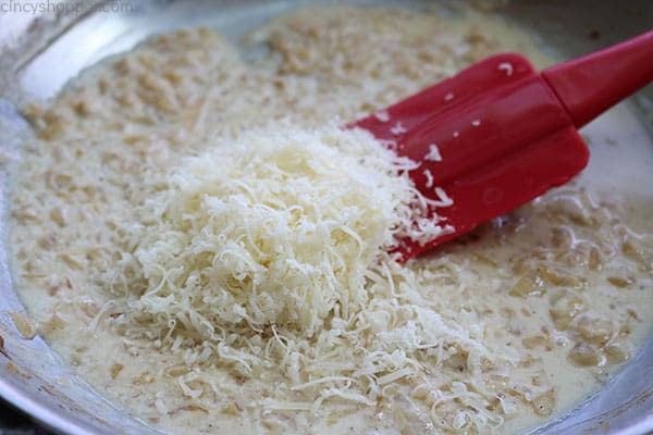 Adding the cheese for Parmesan Zucchini Casserole