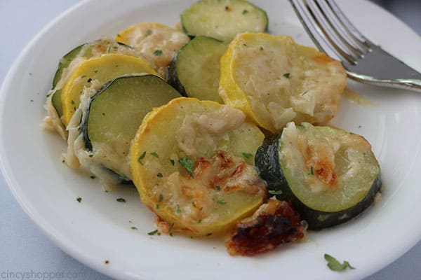 Creamy Parmesan Zucchini slices on plate.