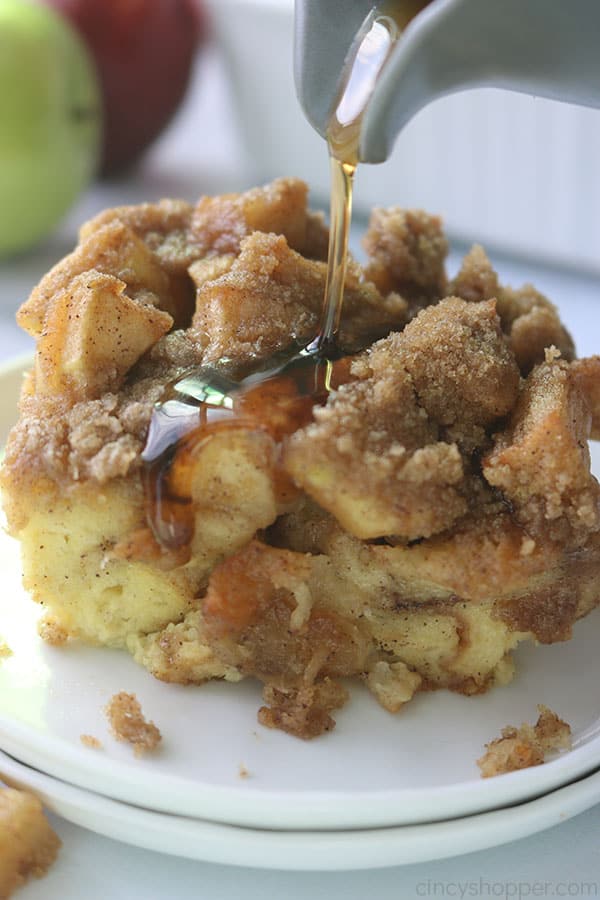 Pouring Syrup on Apple Overnight French Toast Casserole.