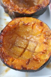 baked acorn squash slices with brown sugar and pecans