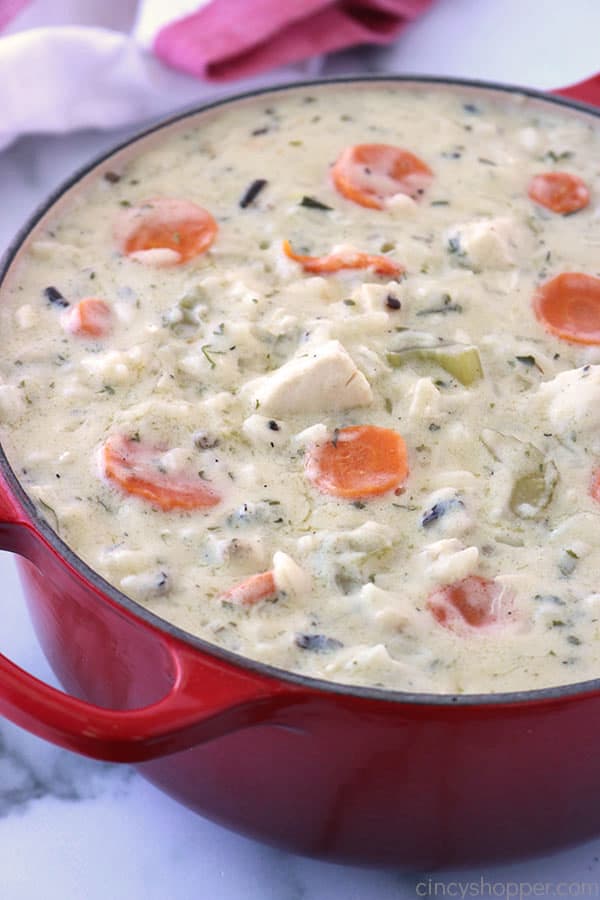 Creamy Chicken and Wild Rice Soup in a red pot.