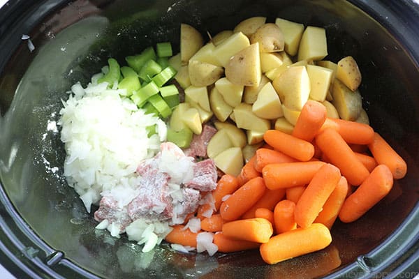 Beef Stew Meat, Potatoes, onions, Carrots and celery in slow cooker.