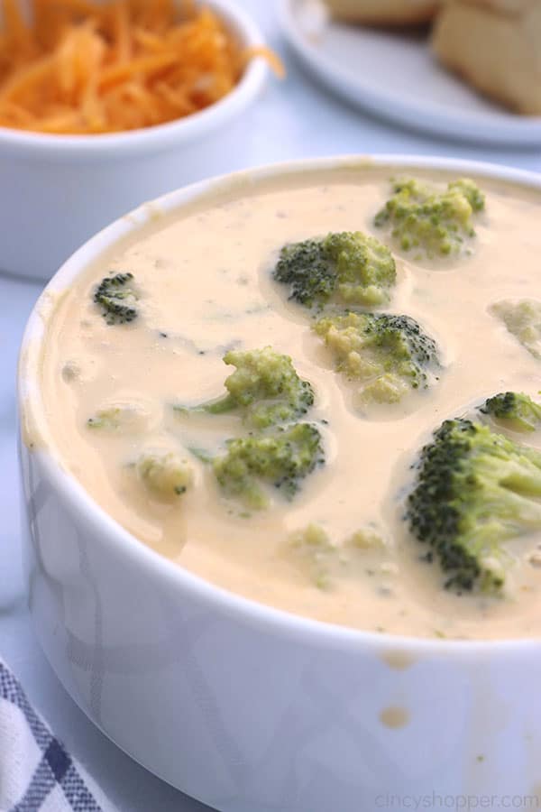 Slow Cooker Broccoli Cheese soup in a white bowl.