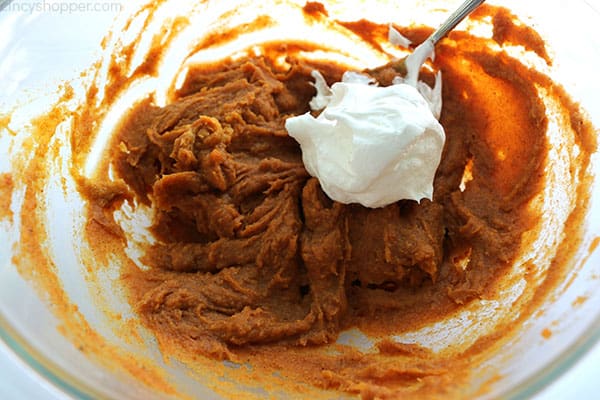 Adding Cool-Whip to pumpkin mixture for Pumpkin Dip.