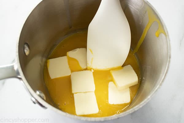 pads of butter added to the egg yolks