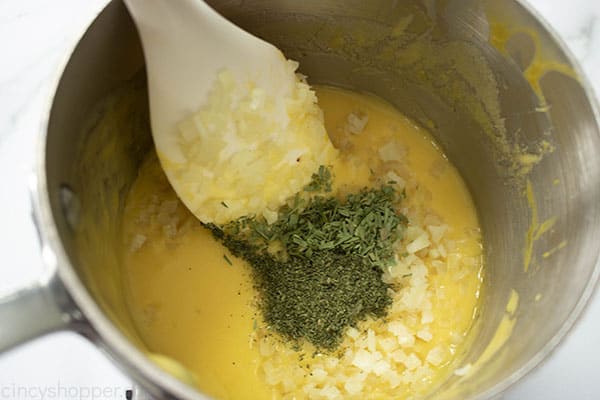 stirring onions and spices into the bearnaise sauce