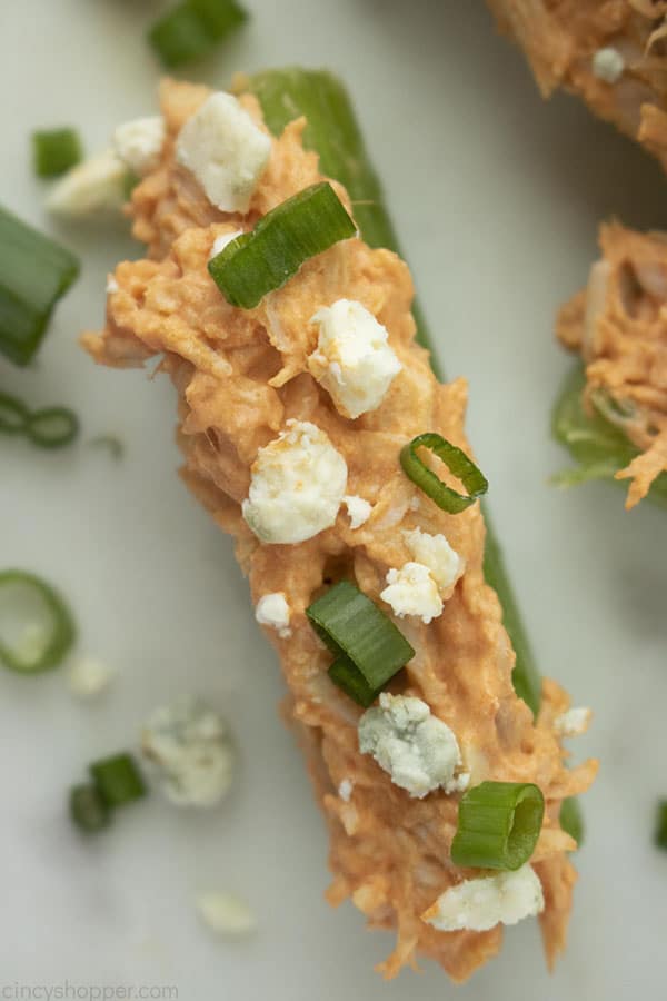 spicy chicken celery sticks with blue cheese and green onions