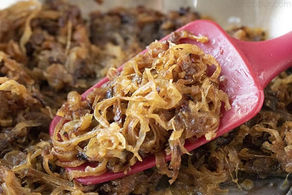 thin slices of cooked onions in a pan