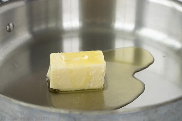 butter melting in stainless steel skillet