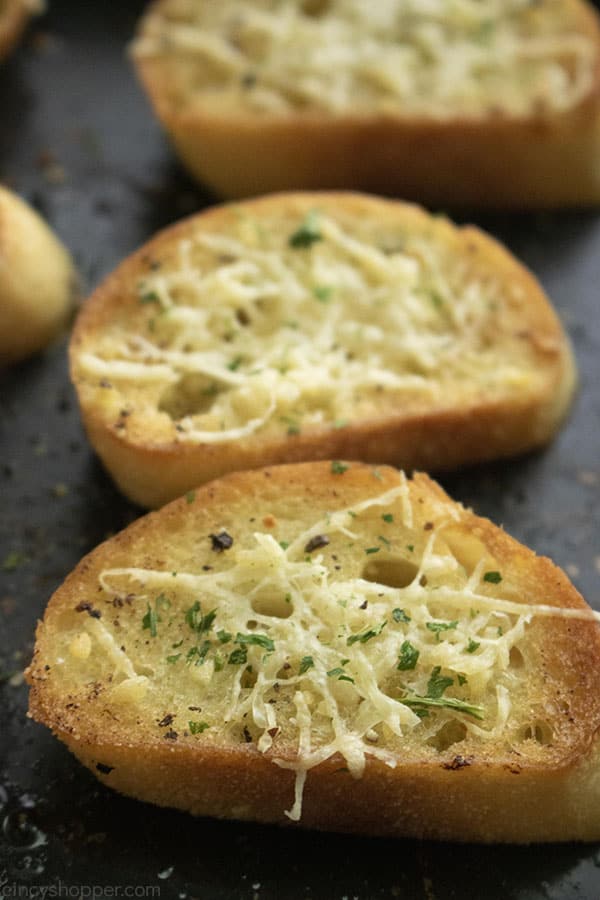 Slices of crostini on a baking tray