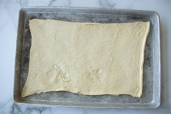sheet of crescent roll dough on baking pan