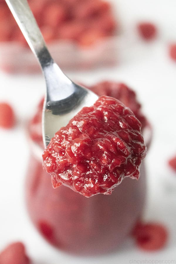 spoonful of fruit puree made from red berries