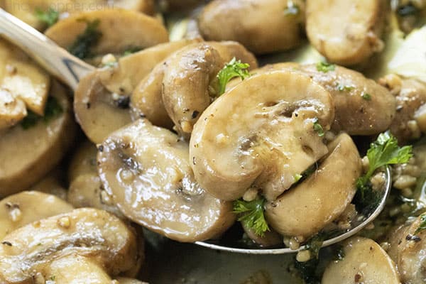 spoonful of cooked mushrooms