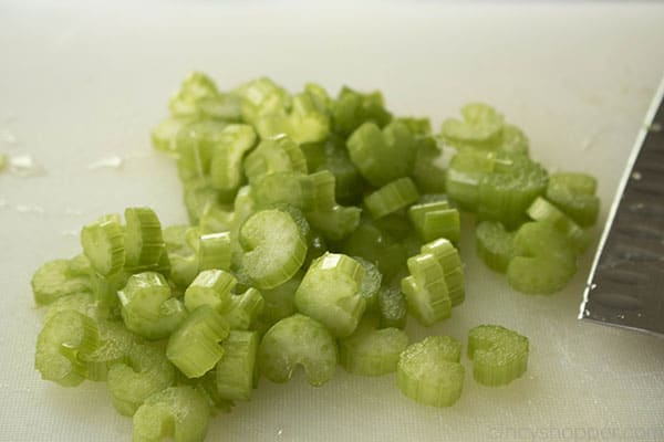 chopped celery on cutting board