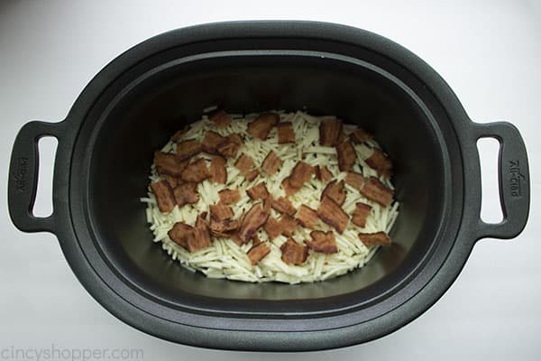 shredded potatoes and crispy bacon in slow cooker