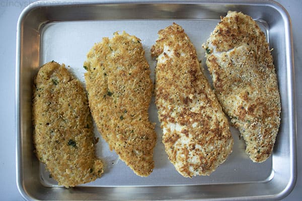 panko coated chicken on baking sheet