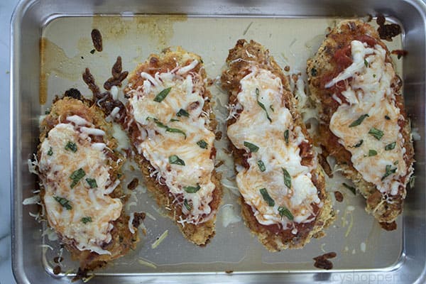 4 chicken breasts on baking pan for chicken parmesan recipe