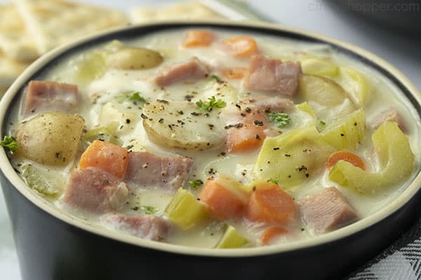 Black bowl filled with cabbage soup