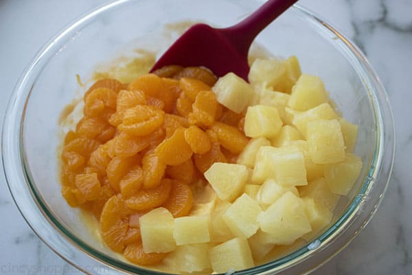 Mandarin Oranges and Pineapple Chunks for salad in a clear bowl