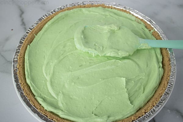 Green pie filling in graham cracker crust