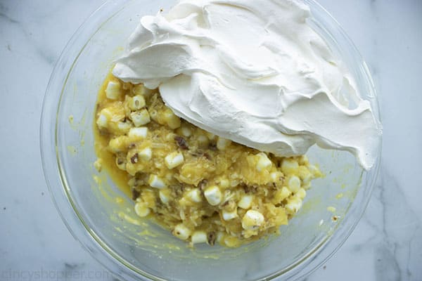 pineapple mixture in bowl with whipped topping