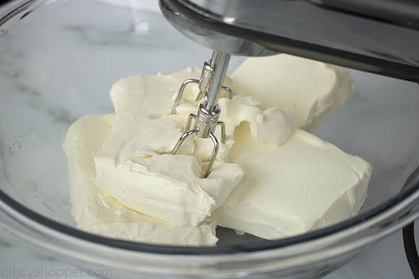 blending cream cheese in mixing bowl