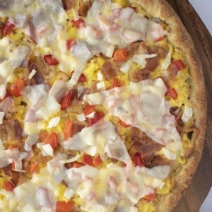 breakfast pizza with bacon eggs and cheese