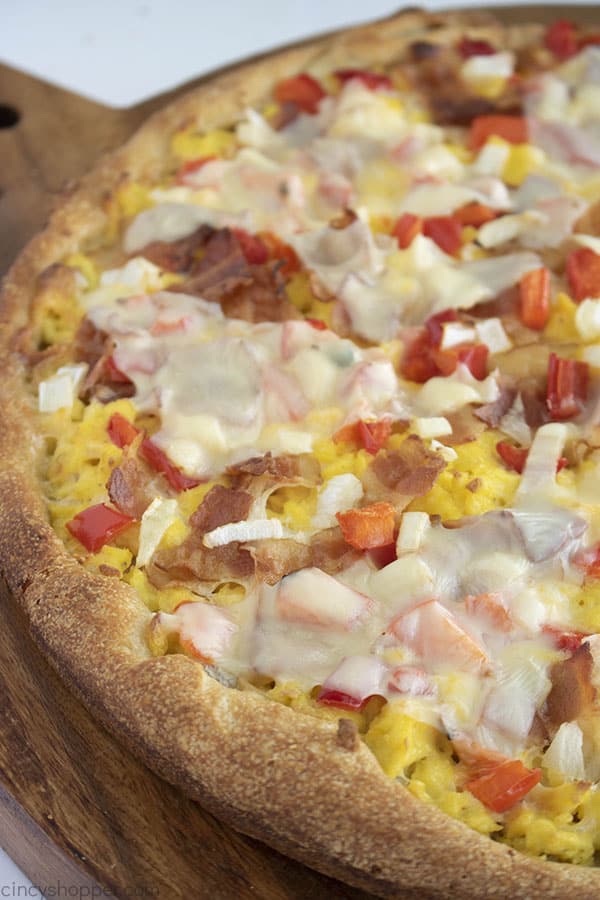 close up photo of homemade pizza with eggs and bacon