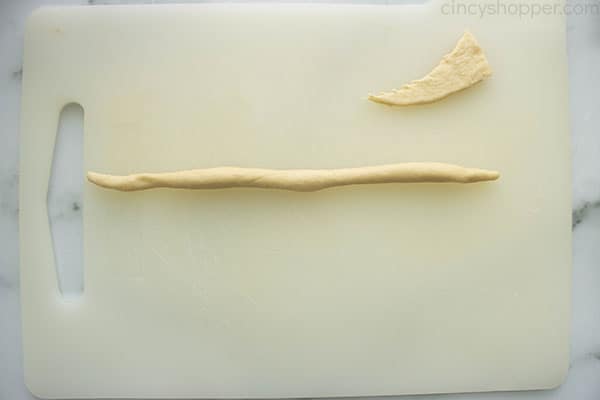 Long piece of rolled crescent dough