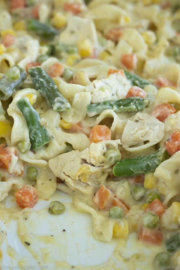 chicken and vegetables with pasta in a baking dish