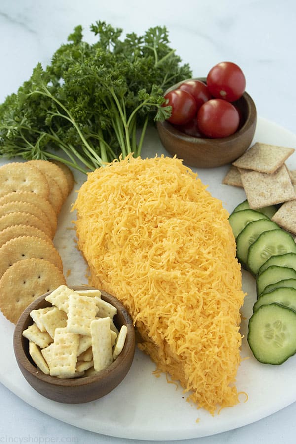 Carrot Shaped Cheese ball on tray with veggies and crackers