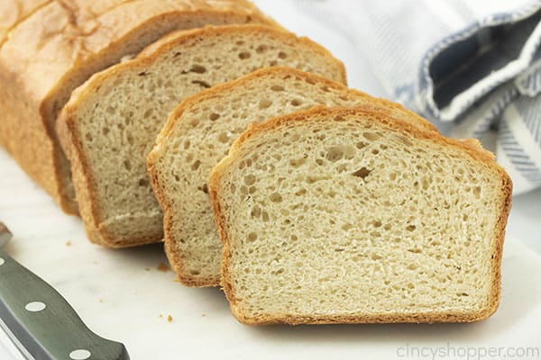 sliced loaf of white homemade bread
