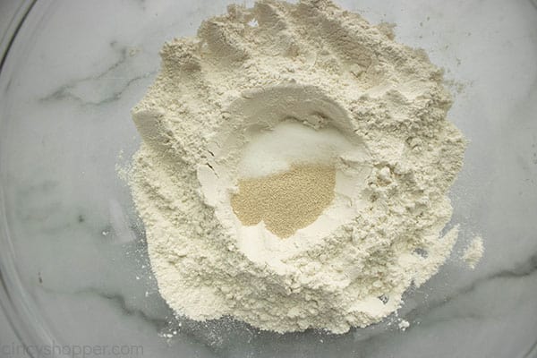 Flour and yeast in a bowl for making homemade pizza