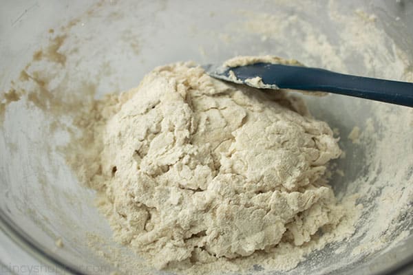 Mixing pizza crust in a bowl