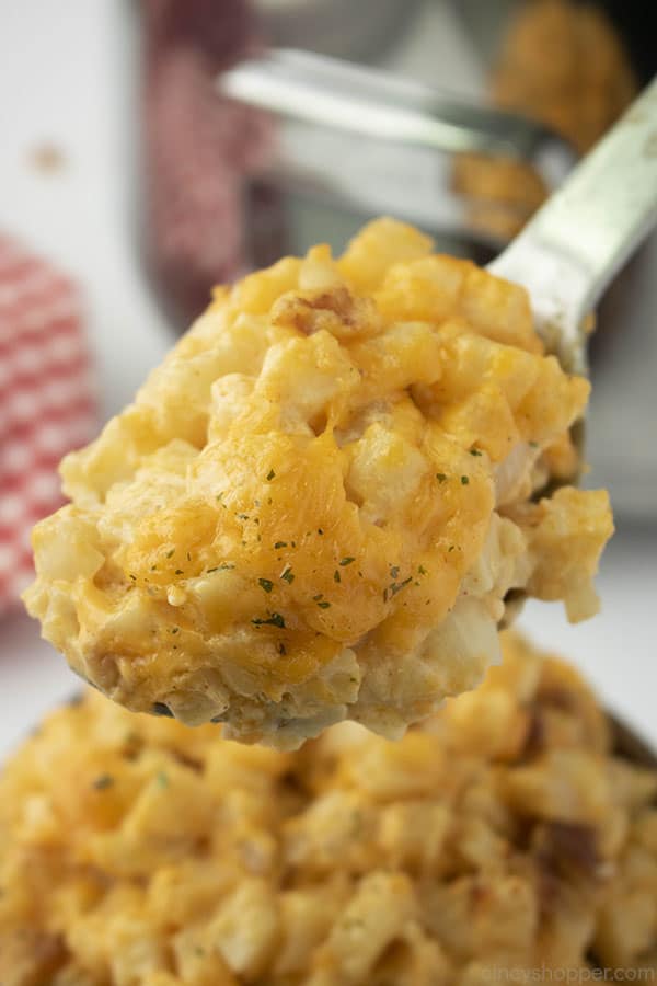Hash brown Potatoes with cheese on a spoon