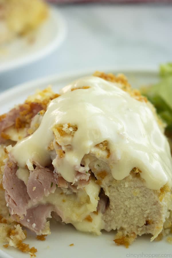 close up: stuffed chicken covered in chicken cordon bleu sauce