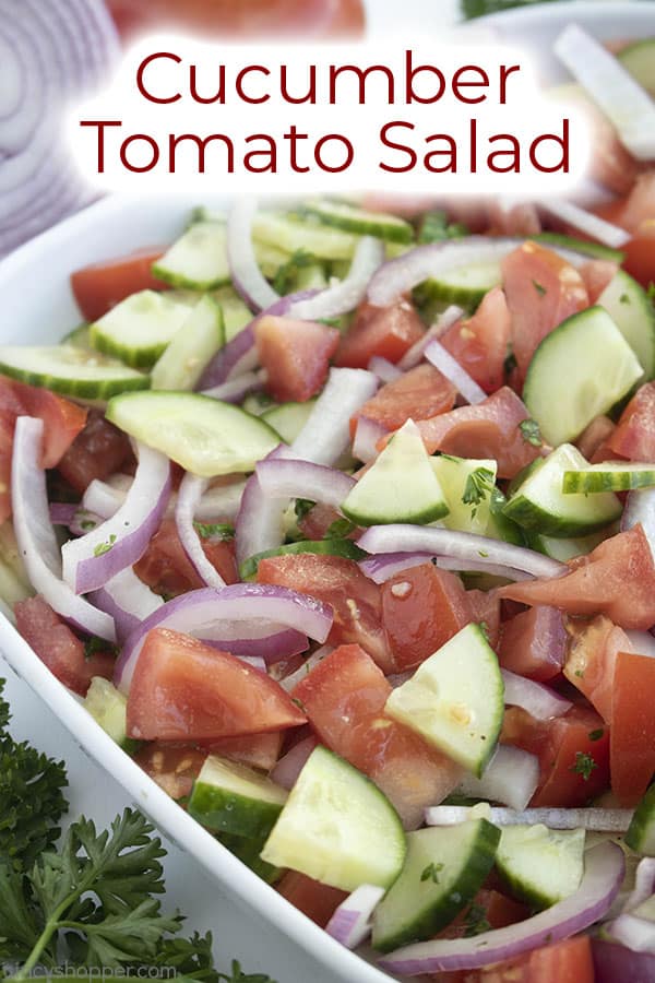 bowl of cucumber tomato salad with heading at the top