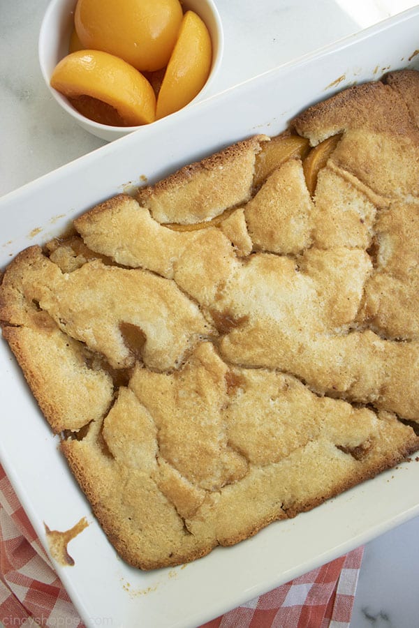 Fresh Baked Easy Peach Cobbler in a white baking dish.