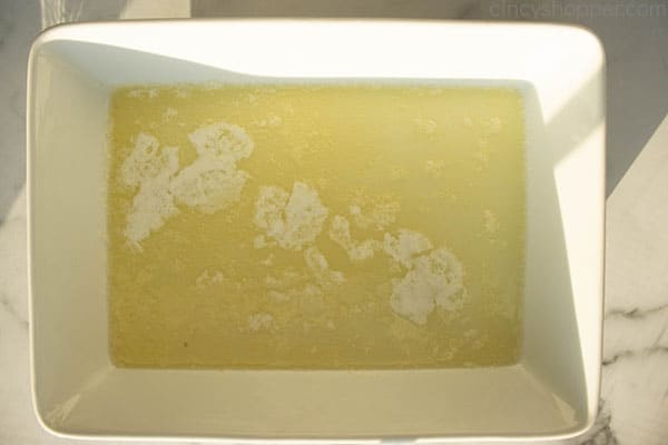 Melted butter in white baking dish