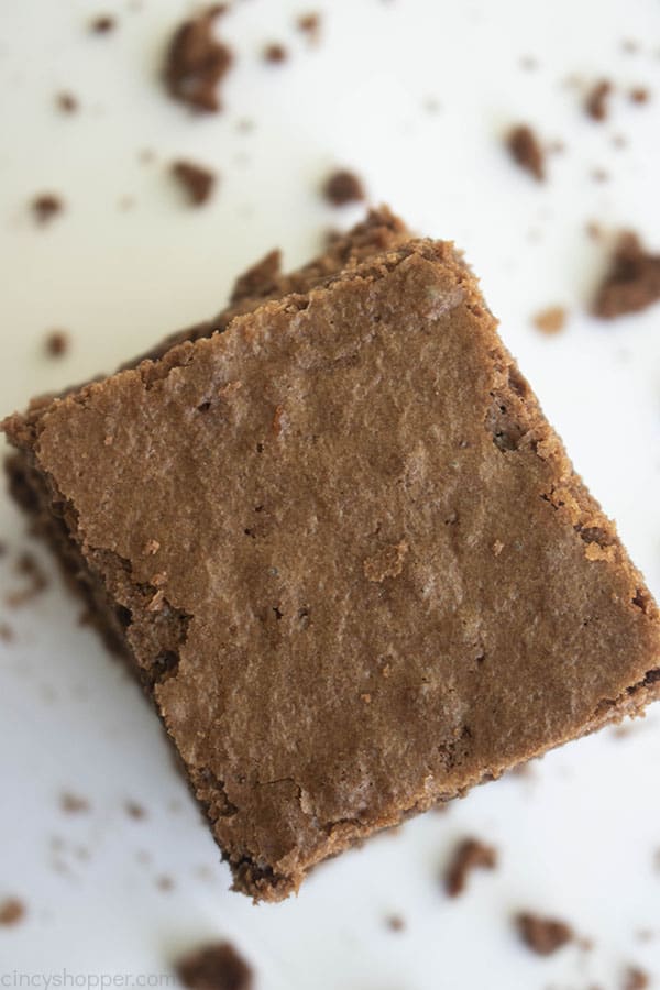 single brownie surrounded by brownie crumbs